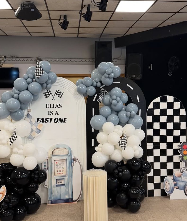Grey, black and white racing themed balloon garland with checkered arch boards
